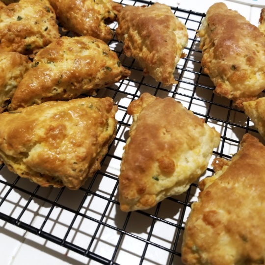 image: baked scones cooling on a tray